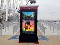 Werbeschild am National Harbor mit Foto eines Riesenrads und dem Text 