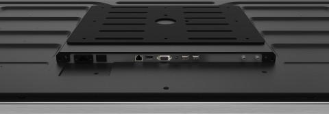 Nahaufnahme der Rückseite eines Digital Signage Displays mit verschiedenen Anschlüssen, darunter HDMI, VGA, USB und LAN-Port